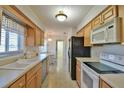 Kitchen boasts ample cabinetry, modern appliances, and eat-in area at 2093 Nw 50Th Cir, Ocala, FL 34482