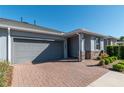 Gray house exterior with gray garage door and brick pavers at 5237 Nw 34Th St, Ocala, FL 34482