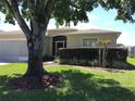 House with mature landscaping and large tree at 15782 Sw 16Th Avenue Rd, Ocala, FL 34473