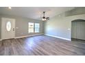 Bright living room with vinyl plank flooring and ceiling fan at 3030 Sw 150Th Ct, Ocala, FL 34481