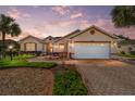 Attractive single-story home with landscaped yard and paver driveway at 8678 Sw 83Rd Cir, Ocala, FL 34481