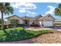 Single-Gathering home with 2-car garage and lush landscaping at 8678 Sw 83Rd Cir, Ocala, FL 34481