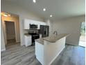 Modern kitchen featuring granite countertops and stainless steel appliances at 5331 Nw 60Th Ter, Ocala, FL 34482