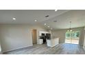 Open living room with high ceilings and vinyl plank flooring at 5331 Nw 60Th Ter, Ocala, FL 34482
