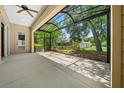 Spacious screened porch overlooking backyard at 3396 Nw 55Th Ct, Ocala, FL 34482