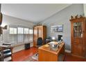 Home office with wooden desk and built-in shelving at 7825 Sw 139Th Pl, Ocala, FL 34473