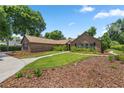 Spacious brick home with lush landscaping and a driveway at 2811 Se 14Th St, Ocala, FL 34471