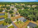 Aerial view of house with pool and large lot at 210 Forest Park Ln, Lady Lake, FL 32159