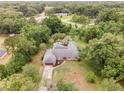 Aerial view of a home with pool and lush landscaping at 5240 Se 17Th St, Ocala, FL 34471