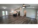 Open concept living room and kitchen with vaulted ceilings at Tbd Bay Drive Pass, Ocklawaha, FL 32179