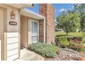 Brick chimney and light tan house exterior with landscaping at 2309 Se 19Th Cir, Ocala, FL 34471