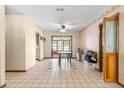 Bright dining area with tile floors and access to a screened porch at 10061 Sw 88Th Ter, Ocala, FL 34481
