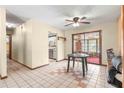 Dining area with tile floors and kitchen access at 10061 Sw 88Th Ter, Ocala, FL 34481