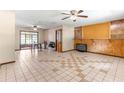 Spacious living room with tile floors and a fireplace at 10061 Sw 88Th Ter, Ocala, FL 34481