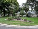 Home's exterior showcasing landscaping with palm trees at 8420 Sw 92Nd St # A, Ocala, FL 34481