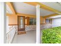 Covered front porch entryway with stone detailing and a welcoming feel at 8890 Sw 96Th St # C, Ocala, FL 34481