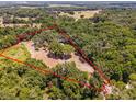 Aerial view of property showing home nestled in the woods at 14260 Ne 40Th Ct, Anthony, FL 32617