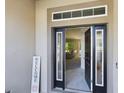 Bright and airy entryway with a view into the living room at 3962 Ne 58Th Cir, Silver Springs, FL 34488