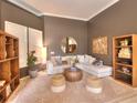 Relaxing living room with a comfy sectional sofa, wooden coffee table, and built-in shelving at 4818 Se 11Th Pl, Ocala, FL 34471