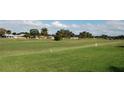 Aerial view of a golf course community with homes at 5495 Nw 23Rd Pl, Ocala, FL 34482