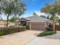 House exterior with driveway and landscaping at 10969 Sw 45Th Ave, Ocala, FL 34476