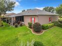 Backyard with patio and lush landscaping at 10969 Sw 45Th Ave, Ocala, FL 34476