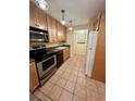 Updated kitchen with ample cabinetry and stainless steel appliances at 2851 Sw 32Nd Ave # 12, Ocala, FL 34474