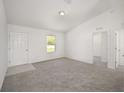 Spacious bedroom with neutral carpeting and ample natural light at 24449 Nw Falcon Ave, Dunnellon, FL 34431