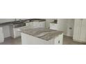 Kitchen island with a beautiful granite countertop at 13260 Se 33Rd Ct, Belleview, FL 34420
