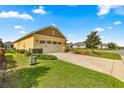 Home exterior showcasing garage and landscaping at 9818 Sw 99Th Loop, Ocala, FL 34481