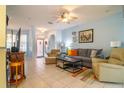 Bright living room with tile floors and access to entryway at 8655 Sw 86Th Cir, Ocala, FL 34481