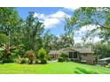 House with a screened porch, pool and lush backyard at 4021 Sw 4Th Ave, Ocala, FL 34471