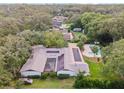 Aerial view showcasing home, pool, and solar panels at 2305 Se 8Th St, Ocala, FL 34471