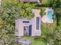 Aerial view of house with pool and solar panels at 2305 Se 8Th St, Ocala, FL 34471