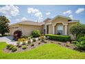 One-story house with a two-car garage and a well-manicured front yard at 15890 Sw 11Th Terrace Rd, Ocala, FL 34473