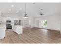 Bright living room with hardwood floors and an open floor plan at 5 Emerald Trl, Ocala, FL 34472