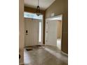 Bright and spacious entryway with tile flooring and double doors at 9288 Sw 192Nd Court Rd, Dunnellon, FL 34432