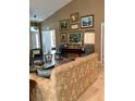 Living room with neutral color palette and gallery wall at 9288 Sw 192Nd Court Rd, Dunnellon, FL 34432