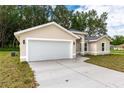 White garage door and driveway at 1 Pine Trace Trl, Ocala, FL 34472