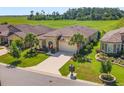 Aerial view of a one-story house with a large yard and driveway at 9793 Sw 63Rd Loop, Ocala, FL 34481