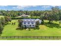 Aerial view of a charming house with a large yard at 7137 & 7141 S Magnolia Ave, Ocala, FL 34476