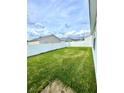 Fenced backyard with grassy lawn at 892 Nash Loop, The Villages, FL 32162