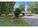 Exterior view of condo building showcasing landscaping and parking at 3031 Se 5Th Ter # D, Ocala, FL 34471