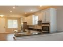 Modern kitchen with stainless steel appliances and granite countertops at 0 Fisher Lane Way, Ocklawaha, FL 32179