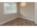Simple dining area with hardwood floors and a window at 0 Fisher Lane Way, Ocklawaha, FL 32179