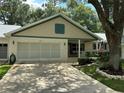 Charming single story home with a two-car garage and well-manicured landscaping at 8420 Sw 92Nd St # B, Ocala, FL 34481