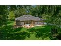 Single story home with stone exterior, lush lawn at 1989 Nw 111Th Loop, Ocala, FL 34475