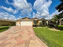 Attractive single-story house with a landscaped yard and driveway at 16376 Sw 13Th Ter, Ocala, FL 34473