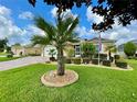 House with palm tree and landscaped yard at 16376 Sw 13Th Ter, Ocala, FL 34473