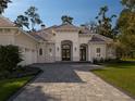 Beautiful house exterior with a paved driveway at 7578 Nw 33Rd Pl, Ocala, FL 34482